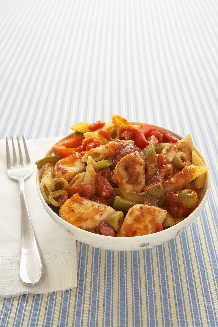 Penne Pasta with Chicken, Tomato and Bell Peppers in a Bowl