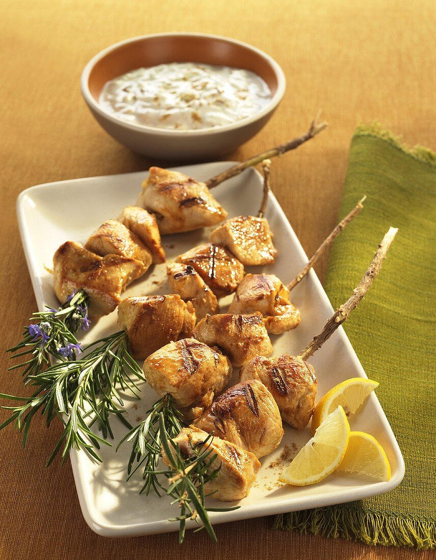 Grilled Chicken Skewers on Rosemary Branches; Dipped Sauce