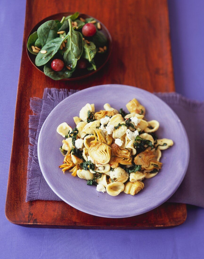 Orecchiette with Artichokes and Cheese on a Purple Plate; From Above