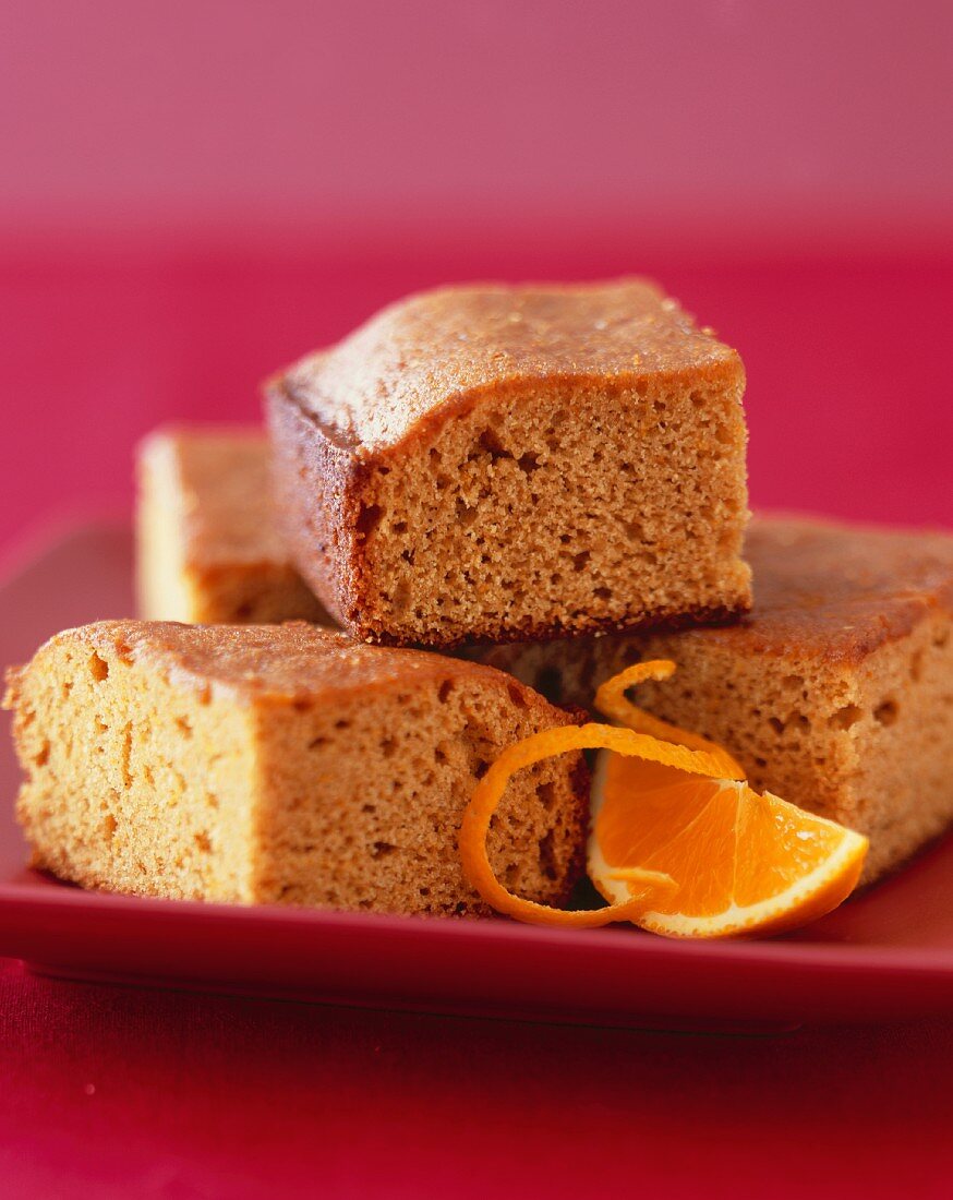 Pieces of Ginger Spice Cake with Orange on a Plate