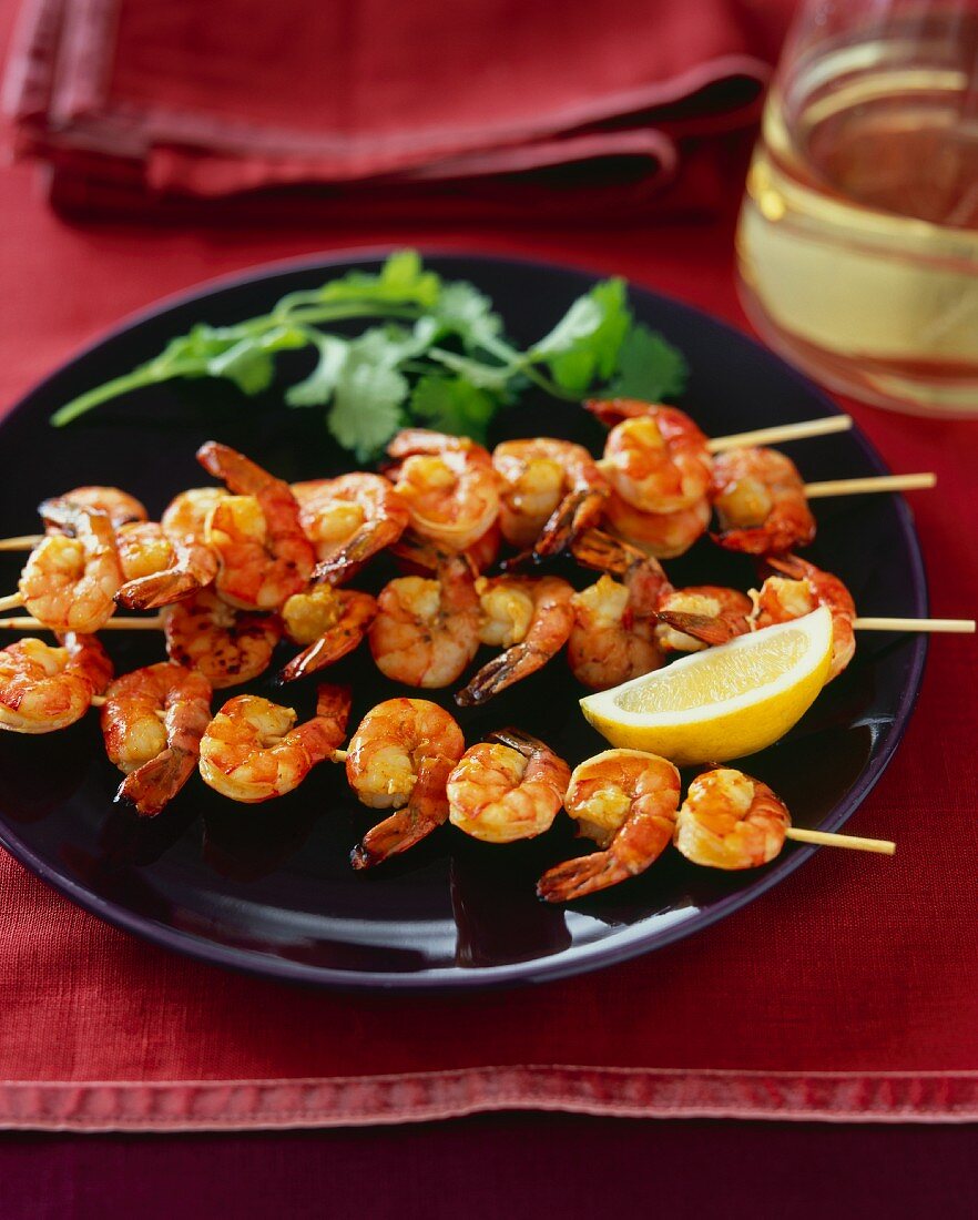 Grilled Mango Curry Shrimp Kabobs with a Lemon Wedge