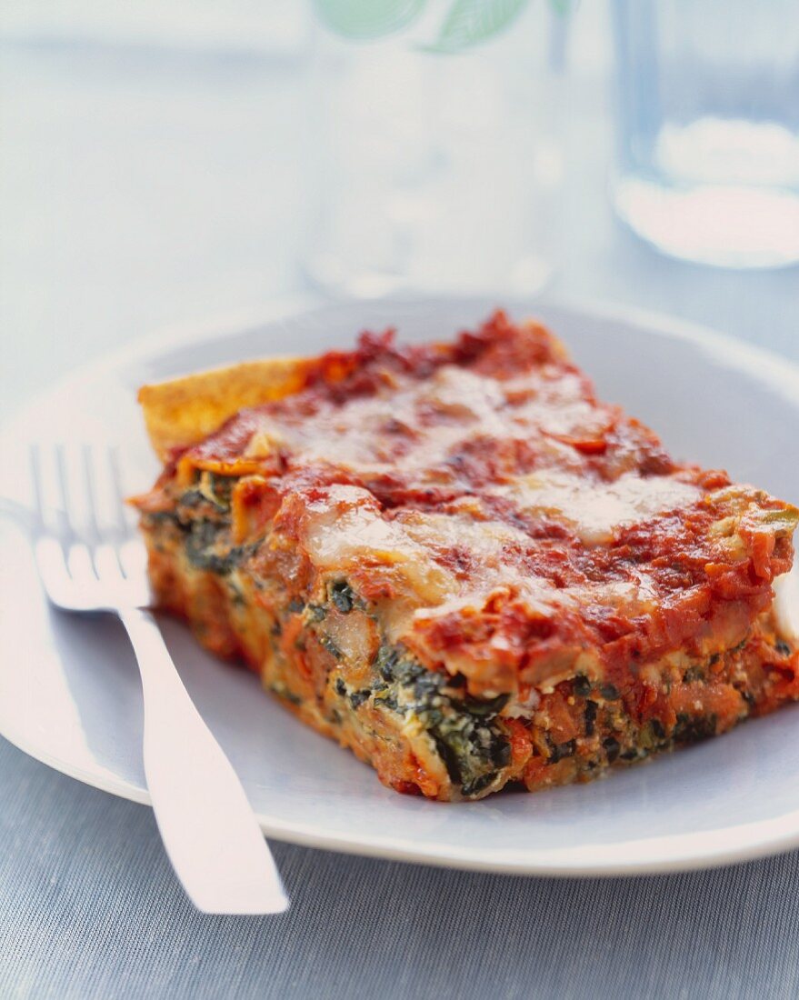 Slice of Veggie Lasagna on a Plate with a Fork