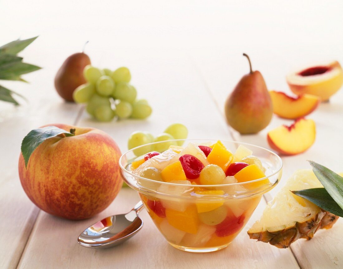 Bowl of Fruit Salad Surrounded by Fresh Fruit