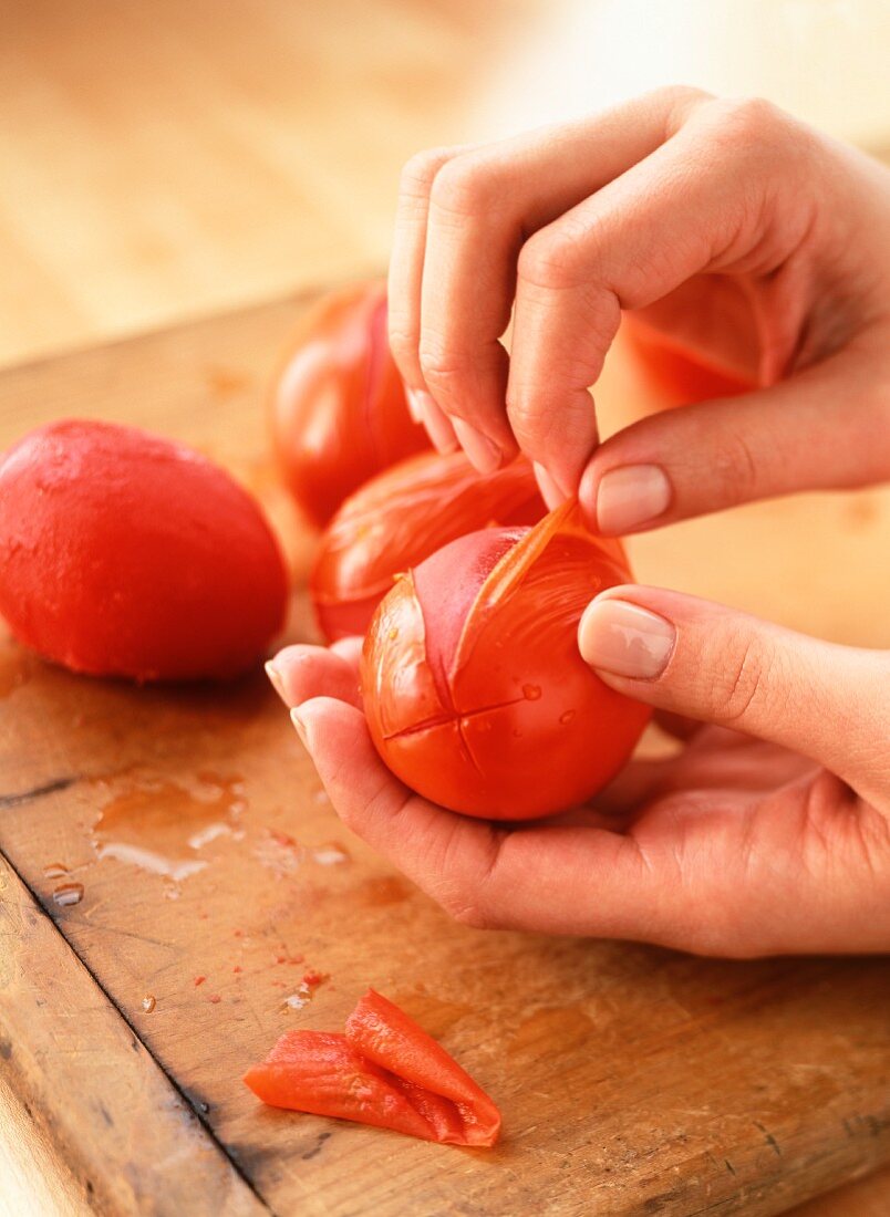 Tomatoes being peeled