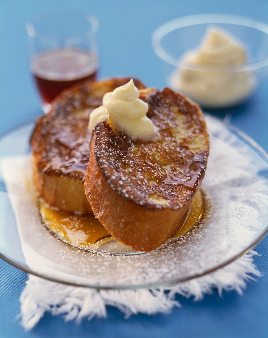 Thick Sliced French Bread French Toast with Butter, Maple Syrup and Powdered Sugar