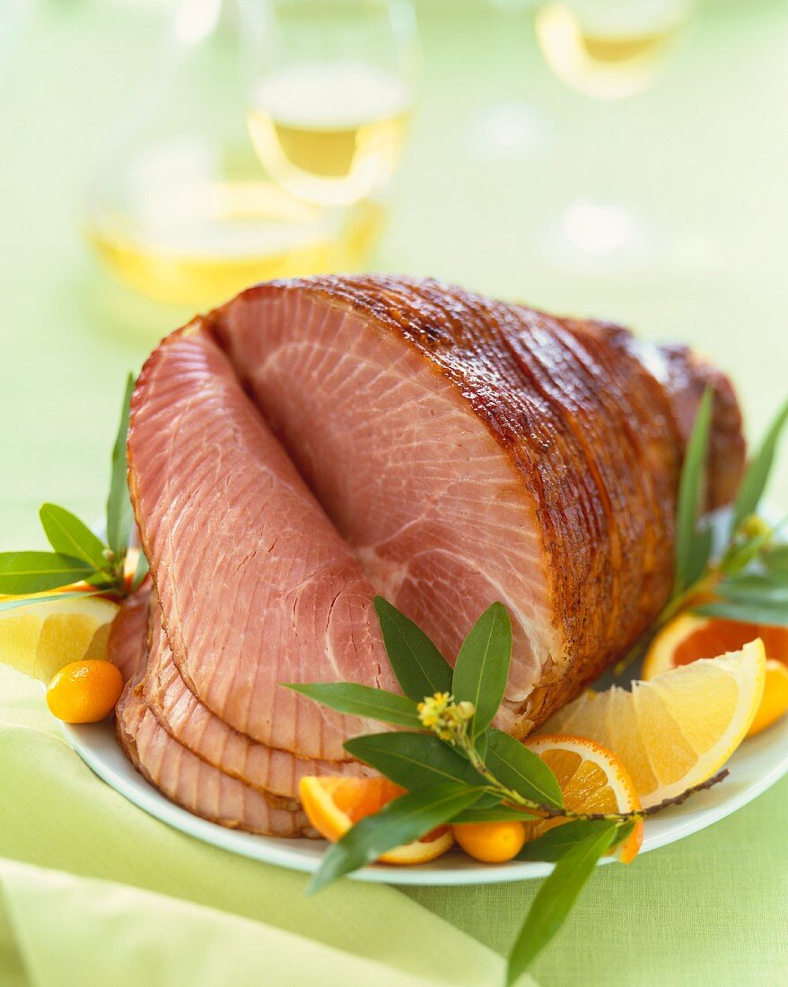 Whole Spiral Cut Ham on a Platter with Citrus Fruit