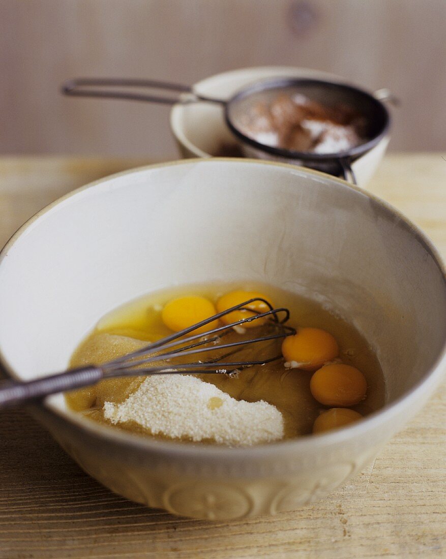 Eggs and Dry Ingredients in a Mixing Bowl with Whisk