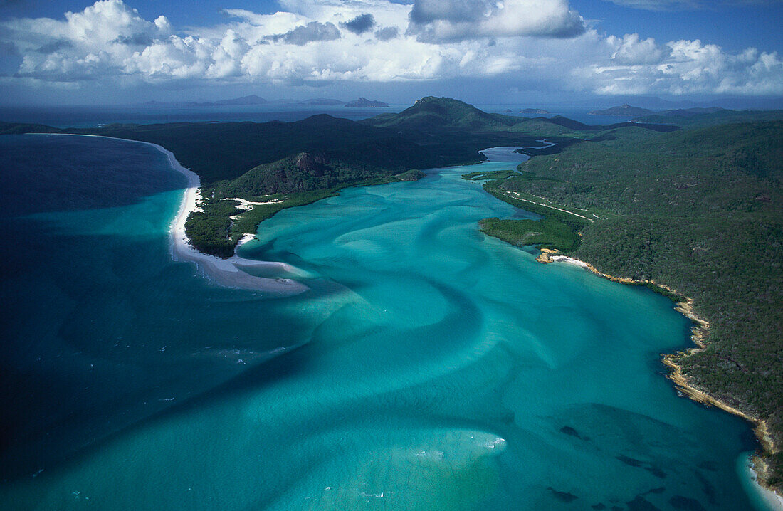 Aerial view of the Whitsunday Islands under clouded sky, Queensland, Australia