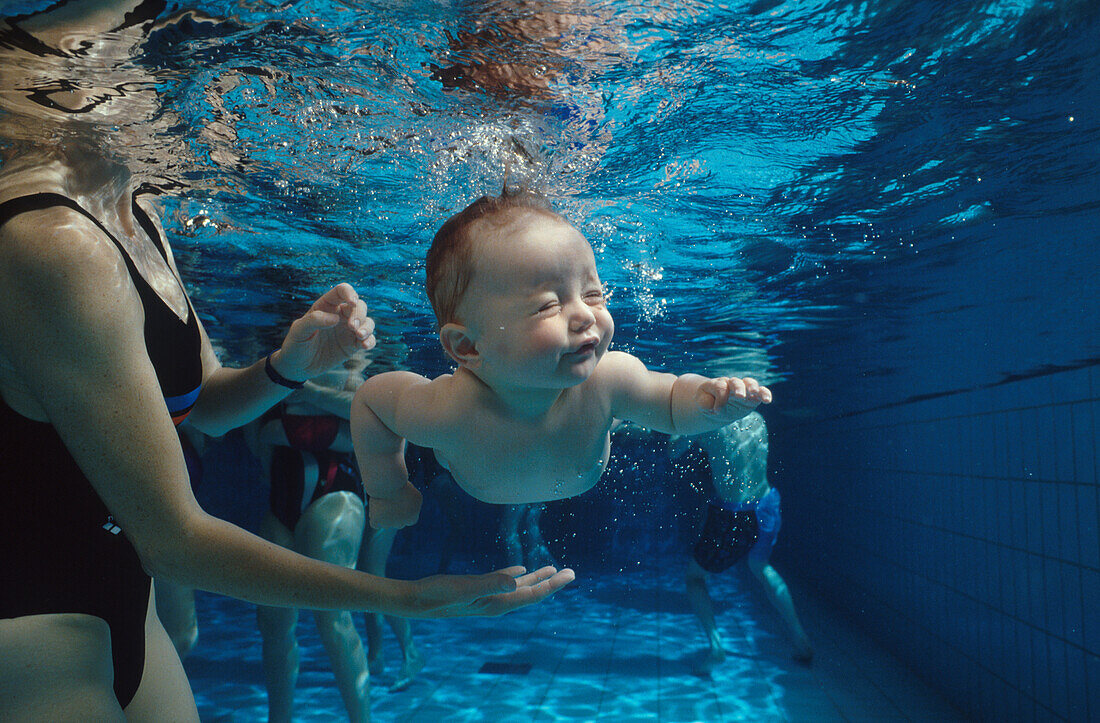 Diving baby in pool