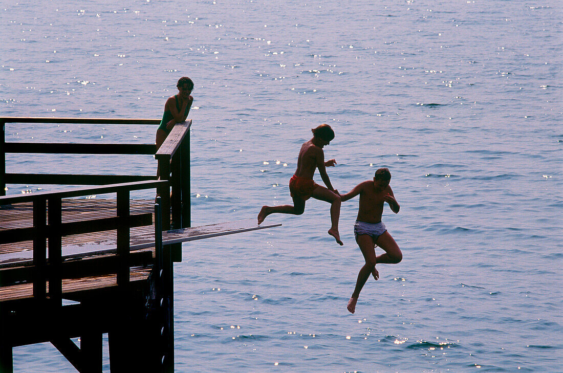 People jumping into water, Bregenz, Lake of Constance, Austria