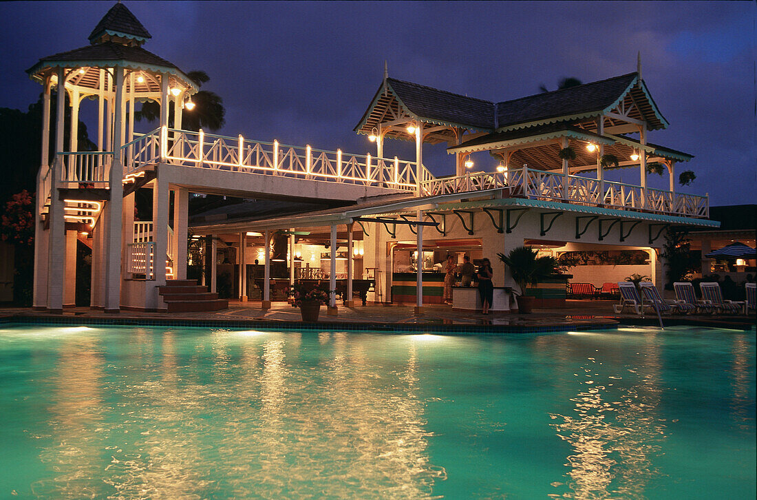 Illuminated hotel and pool at night, Sandals Halcyon Beach Resort, St. Lucia, Caribbean, America