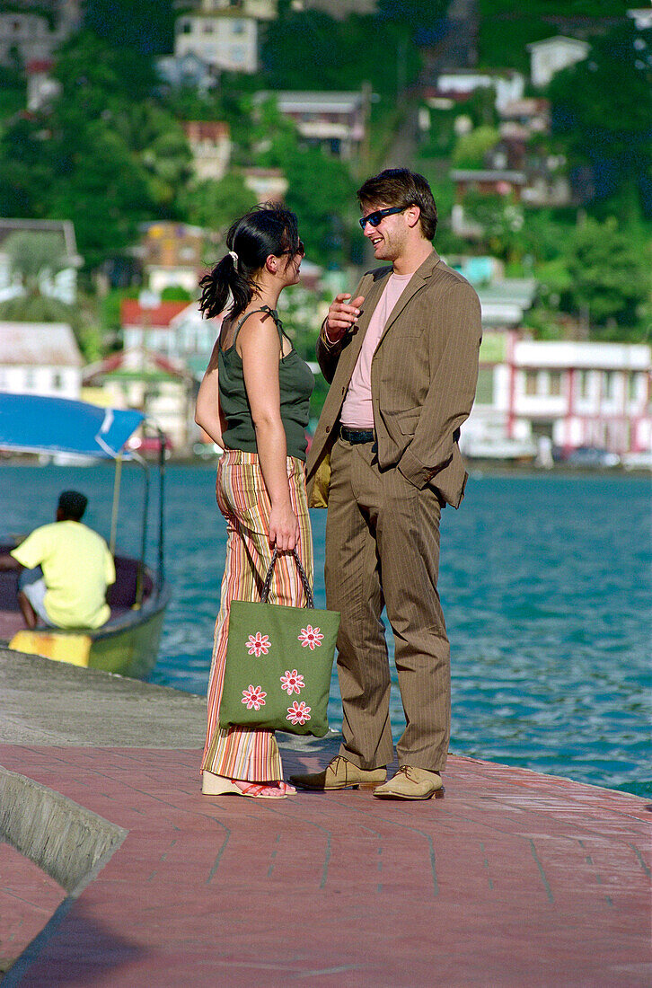 Young couple at the harbour, St. George´s, Grenanda, Caribbean