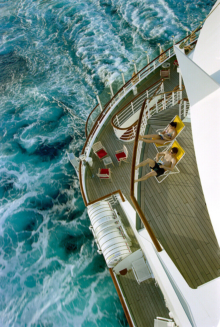 Young couple sunbathing, Cruise ship Aida, Caribbean, America
