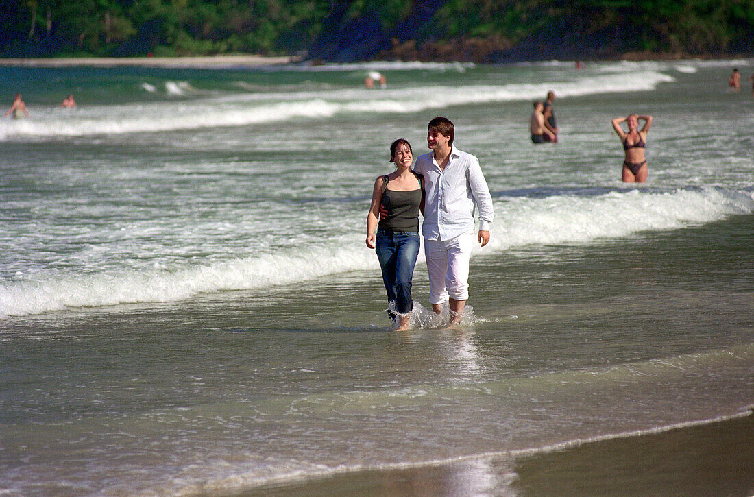 Young couple walking at Maracas Bay, Trinidad, Caribbean