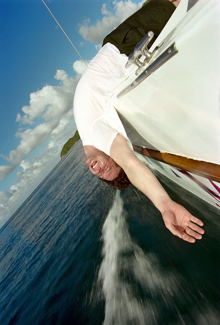 Young man head over the ocean, near Anse Cochon, St. Lucia, Caribbean