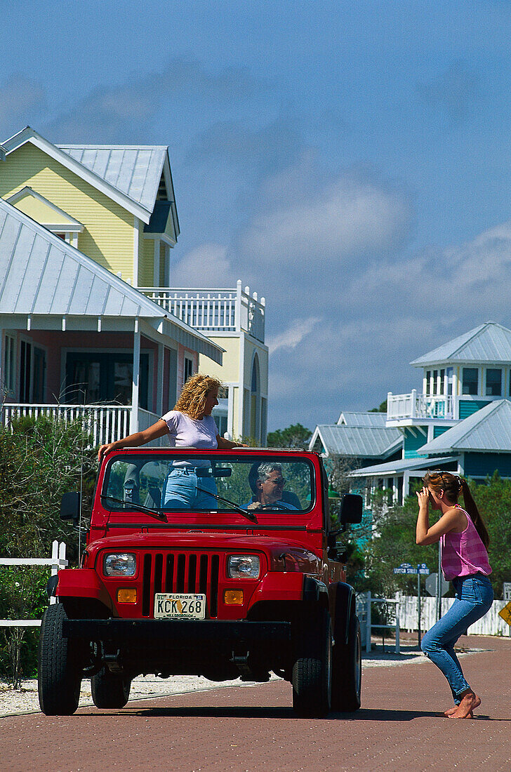 Young people in a jeep, Santa Rosa Island Florida, USA