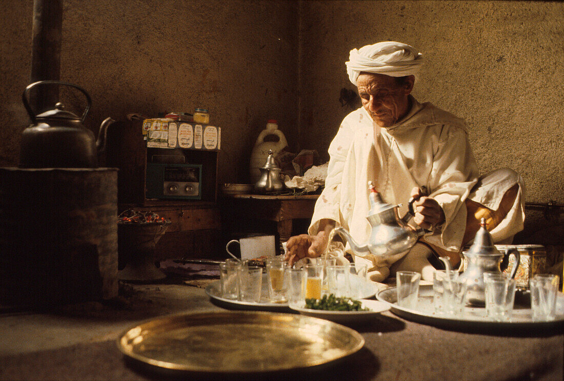 Berber brewing tea, Marocco, Africa