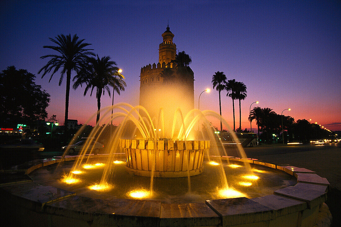 Torre del Oro at night, Gold tower, a military watchtower, Paeso de Christobal, Colon, Seville, Andalusia, Spain