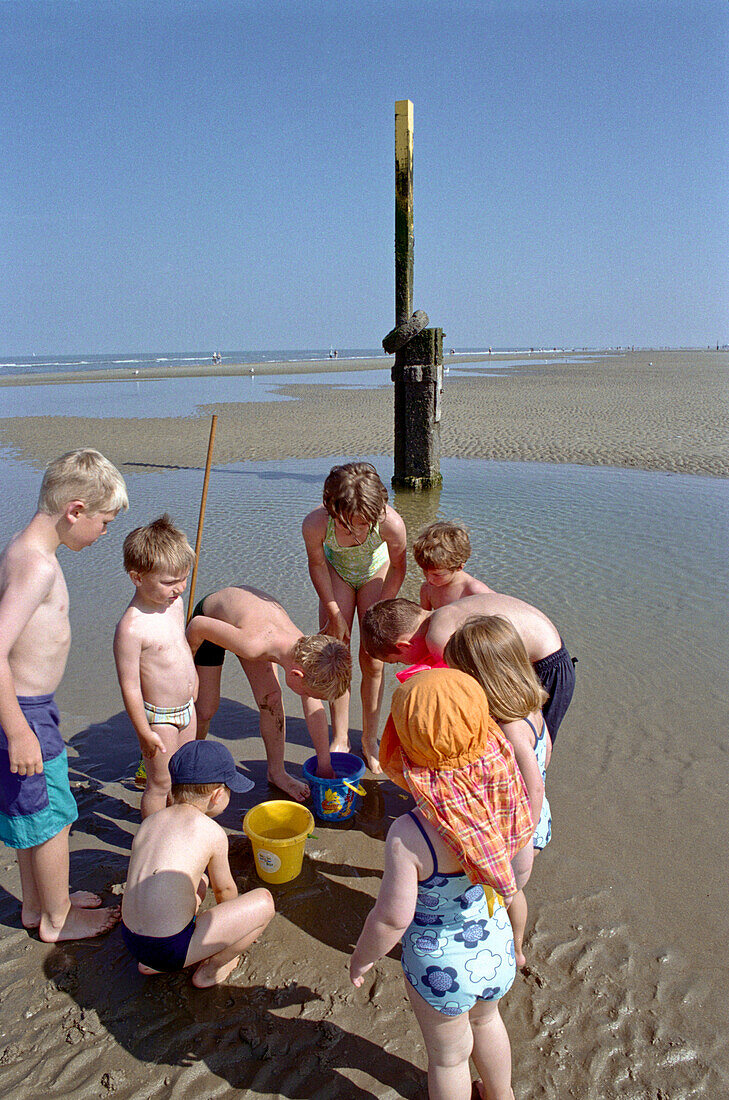 Children playing on the beach, De Haan Belgium