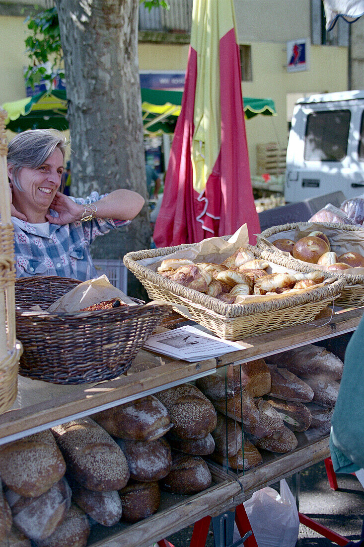 Woman sells Bread, Nyons, Drome France
