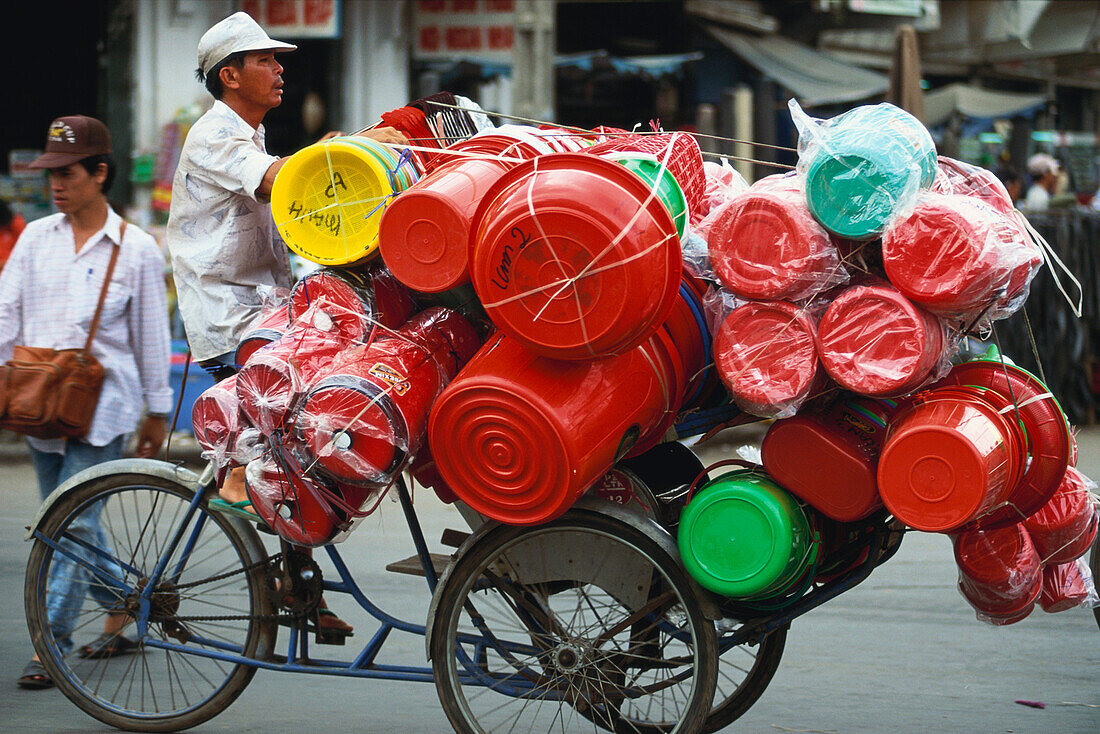 Trader with goods on a bicycle, Chinatown, Saigon, Vietnam, Asia