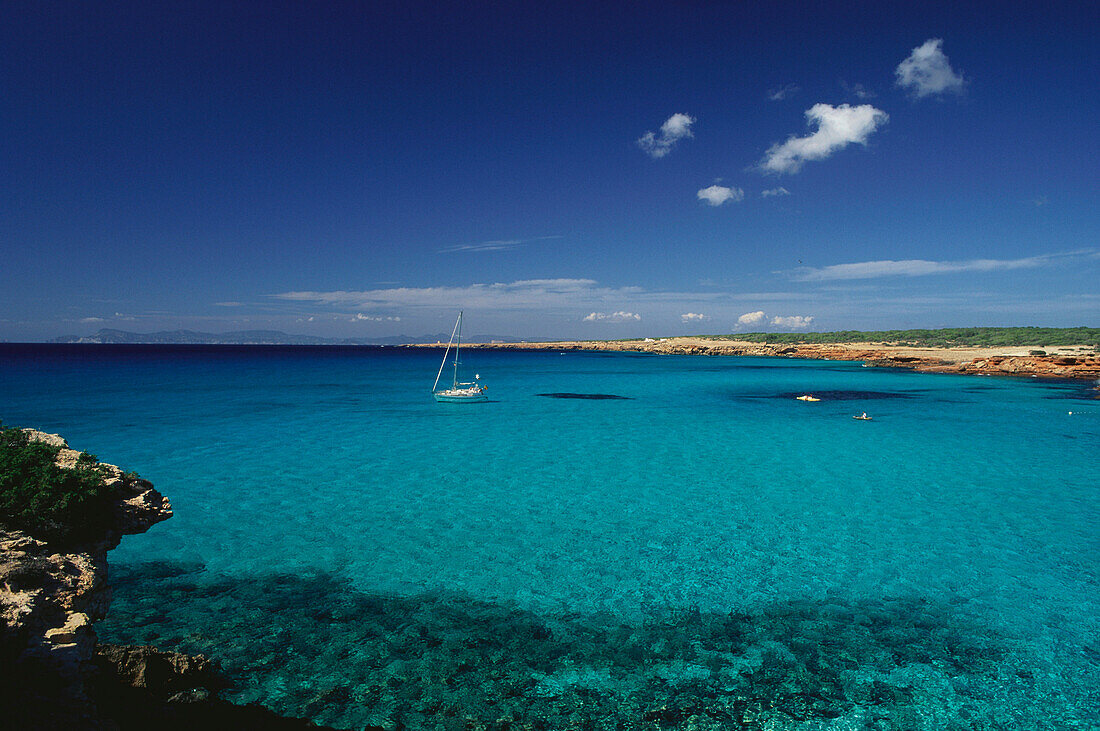 Boat in the bay of Gavina under blue sky, Formentera, Balearic Islands, Spain, Europe