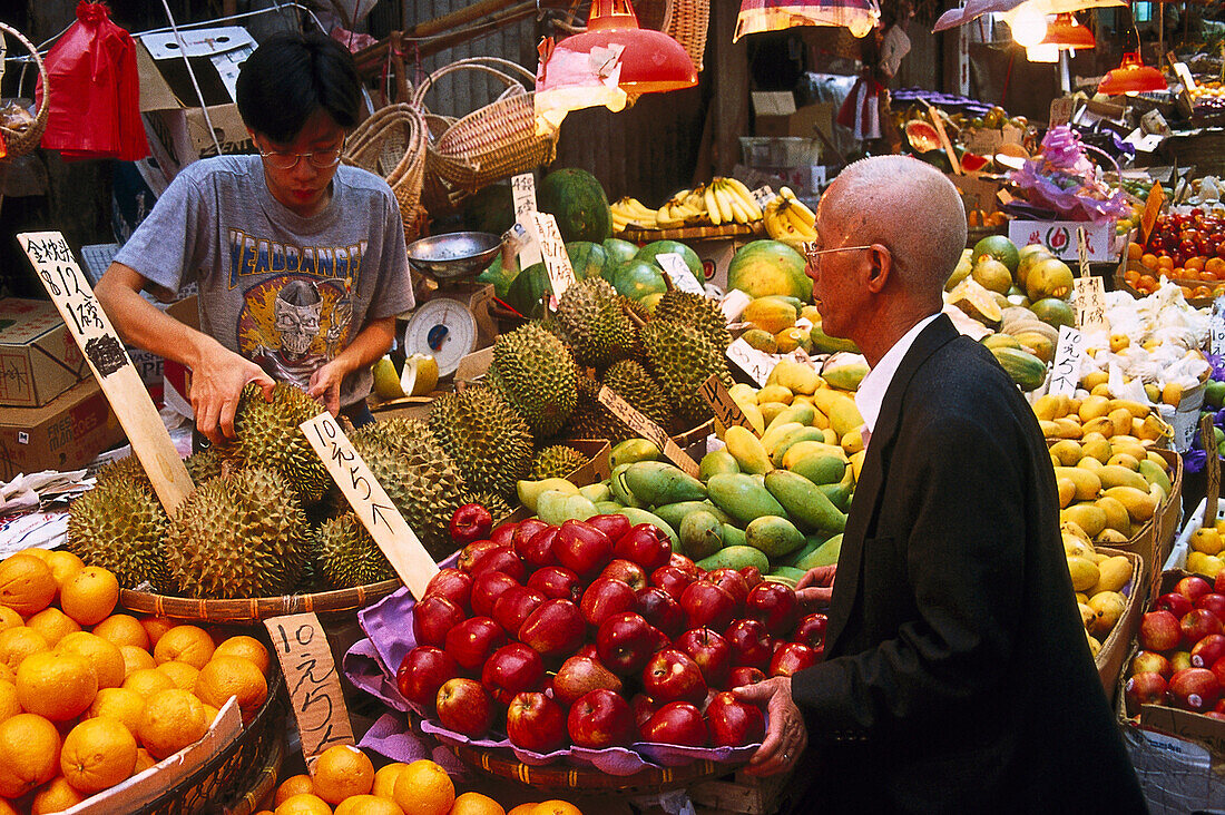 People at a market stand with fruit, Hongkong, China, Asia