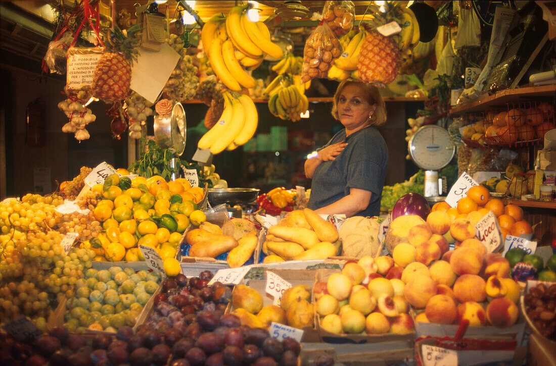 Woman at a market stand with fruit, Bologna, Italy, Europe