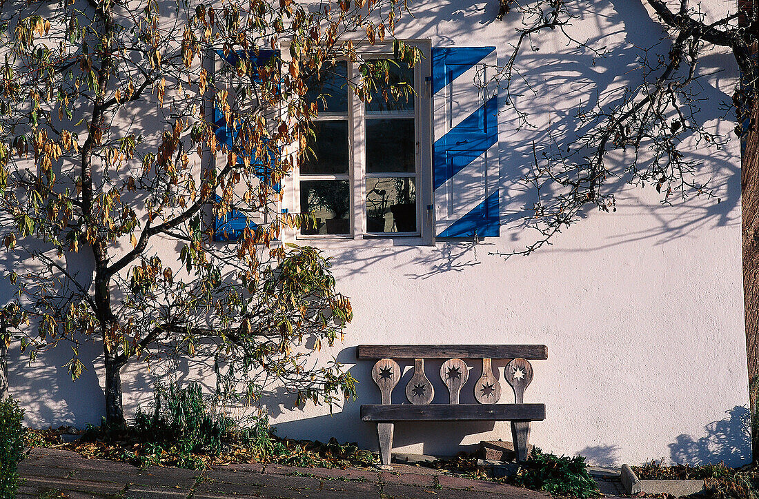 Bench in front of a farmhouse, Bavaria, Germany