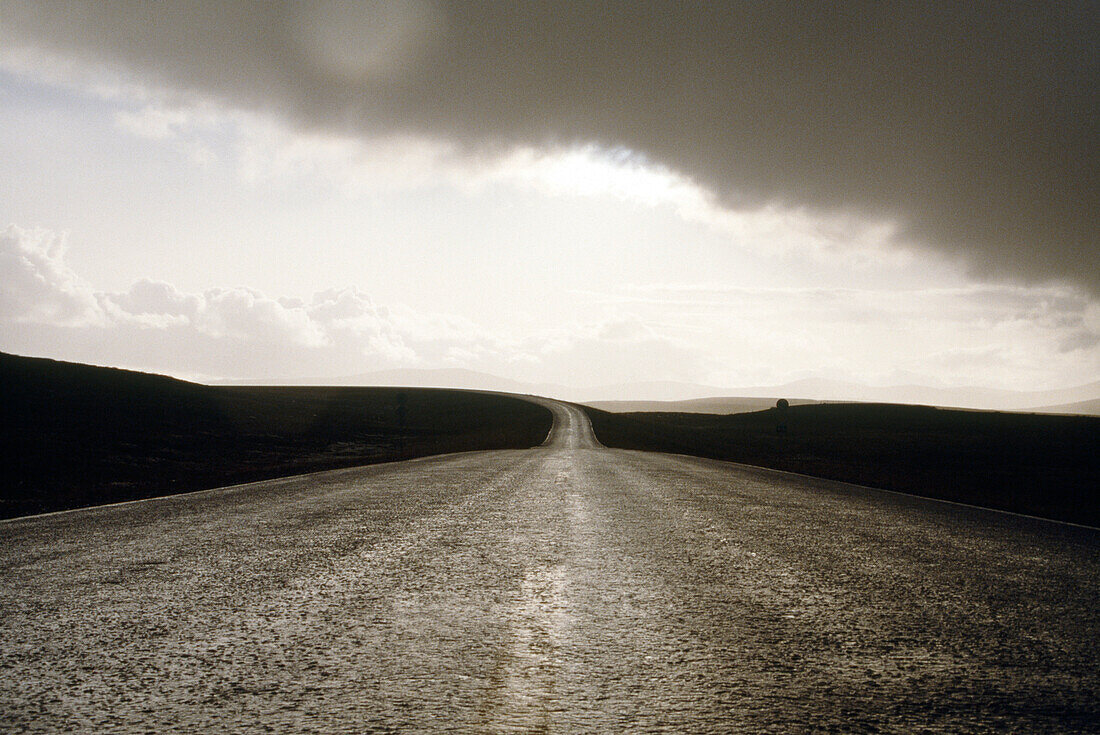Lonesome rain-soaked country road, Finnmark, Norway
