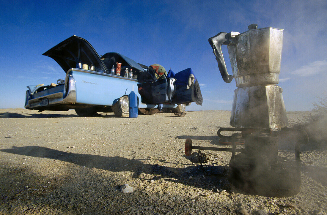 Smoking camping stove and a cadillac, Baja California, Mexico