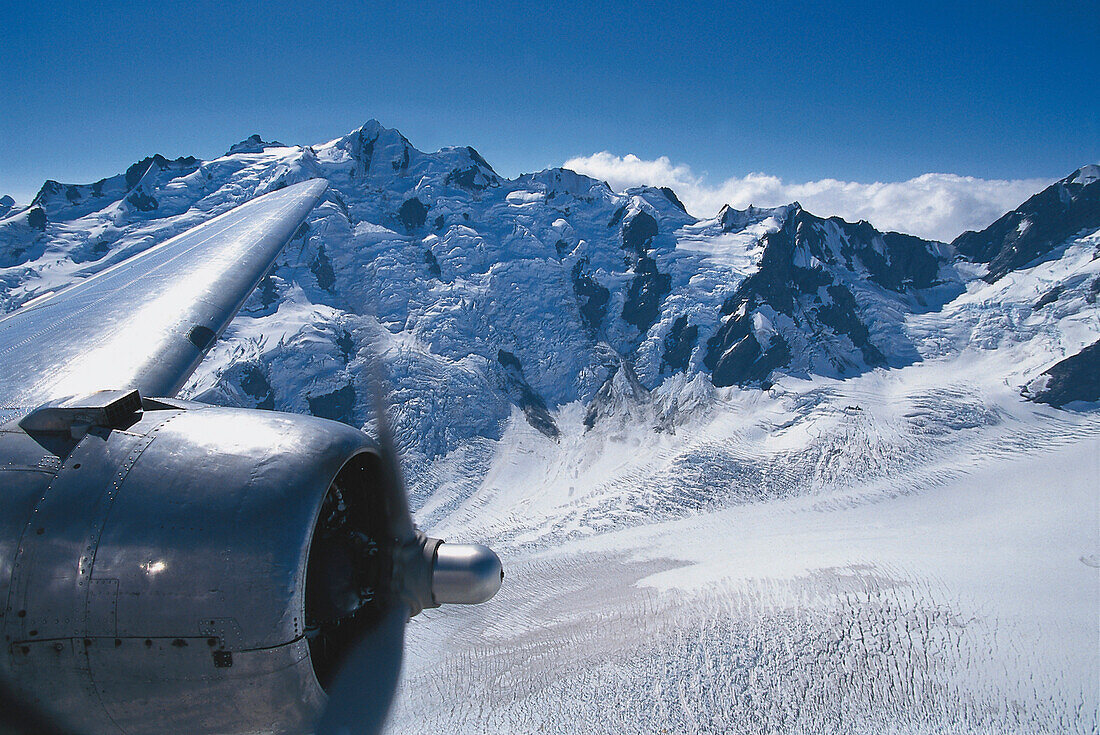 View of the mountains over the jet engine, DC-3 Tour aerial tour, Southern Alps, New Zealand