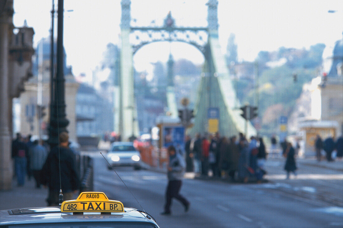 Cab in front of Liberty Bridge, Budapest, Hungary
