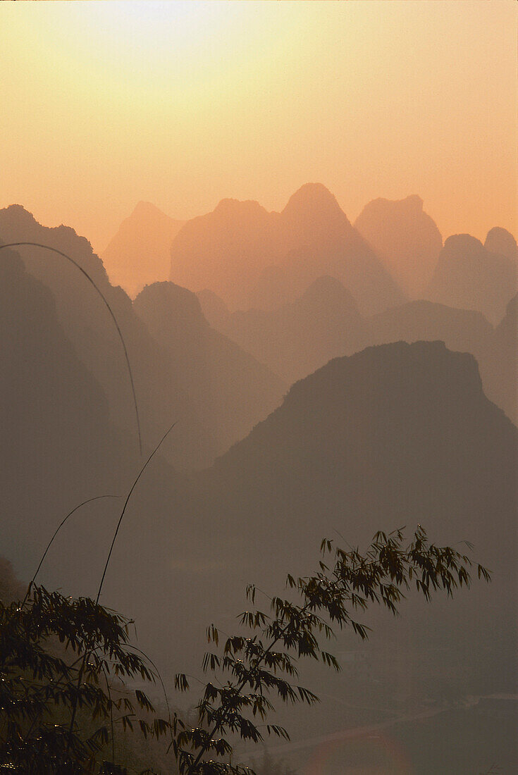 View over mountains at sunset, Guilin, China, Asia