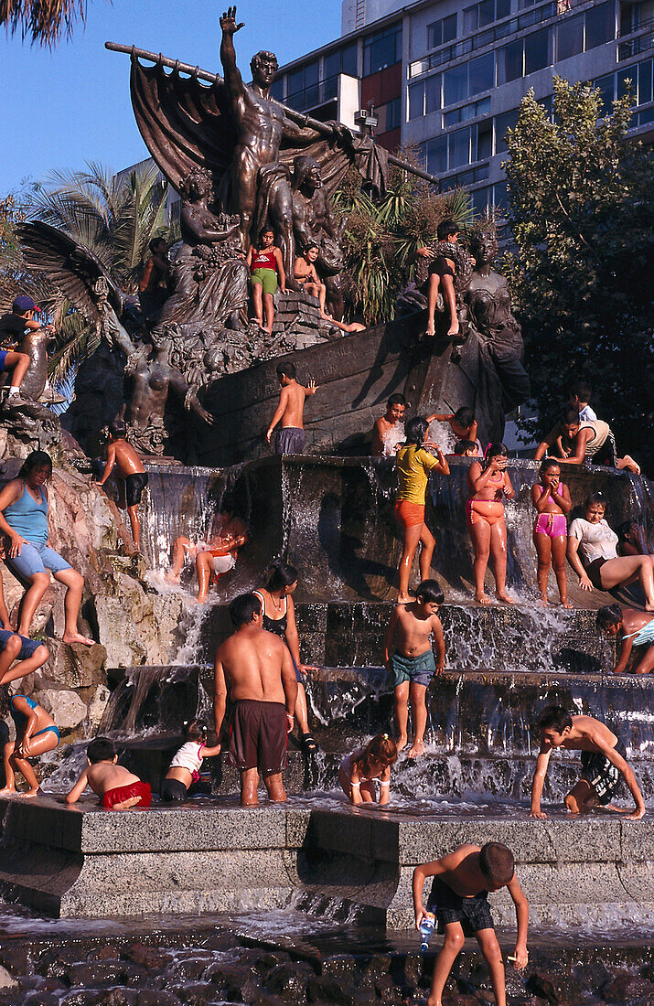 Children bathing in a fountain, Parque Forestal, Santiago, Chile, South America, America