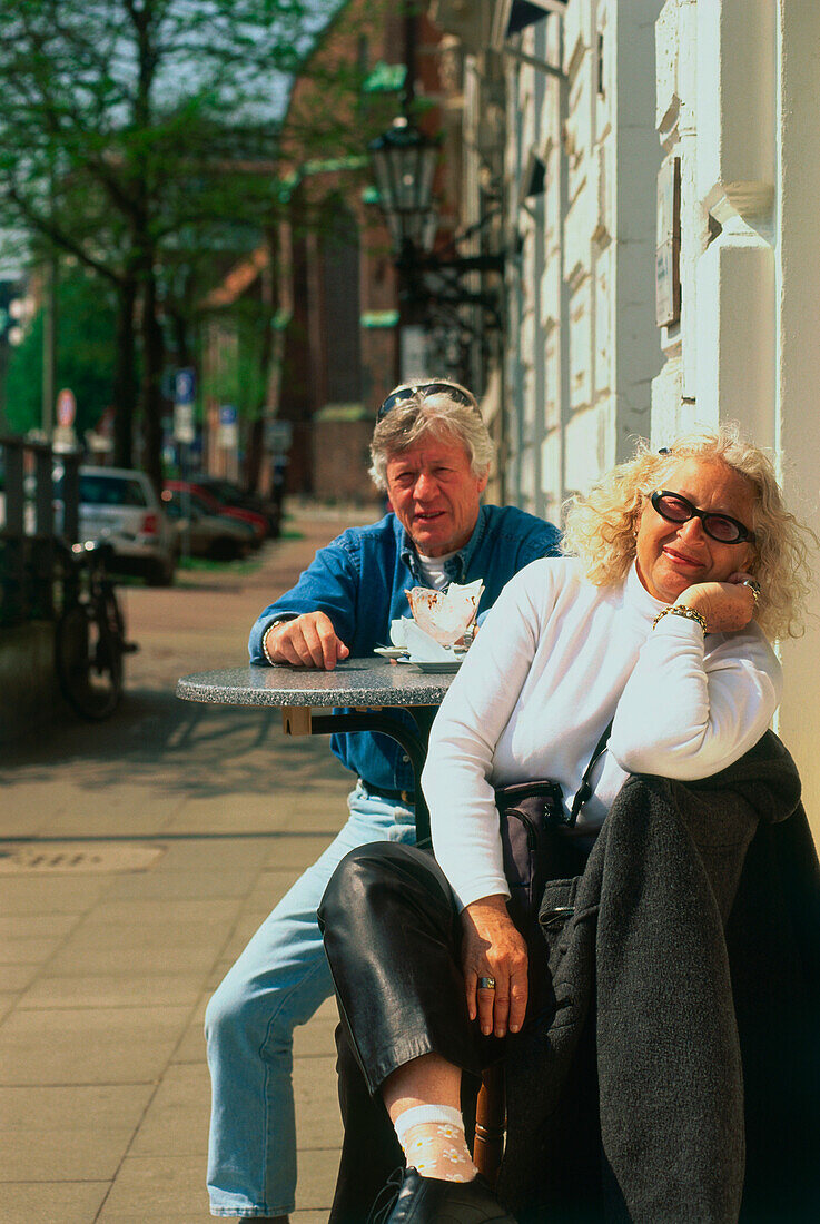 Two people at sidewalk café, Hamburg, Germany