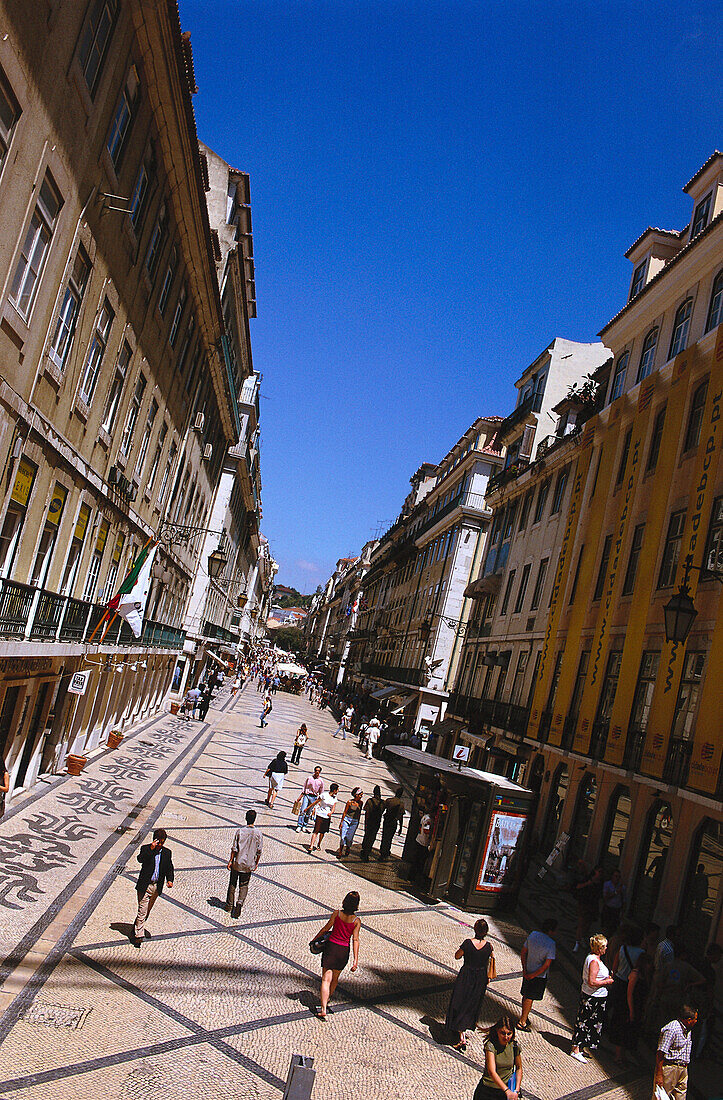 Street of Baixa with passers-by, Baixa, Lisbon, Portugal