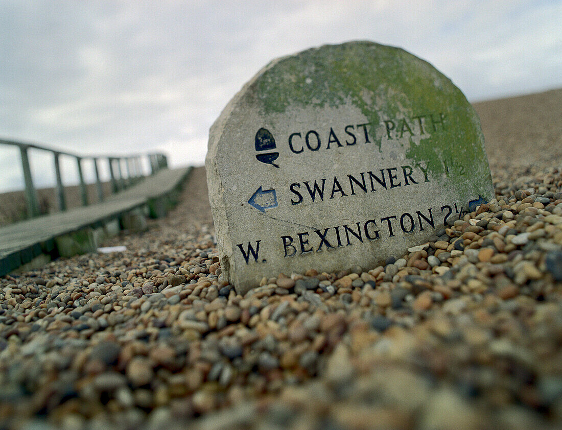 Direction sign on the beach, Chesil Bank, South, England Great Britain
