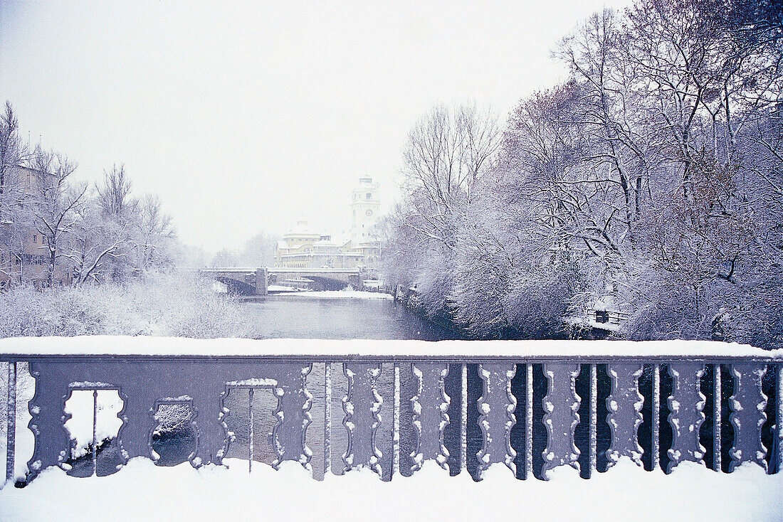 View over river Isar to Mullersches Volksbad in winter, Munich, Bavaria, Germany