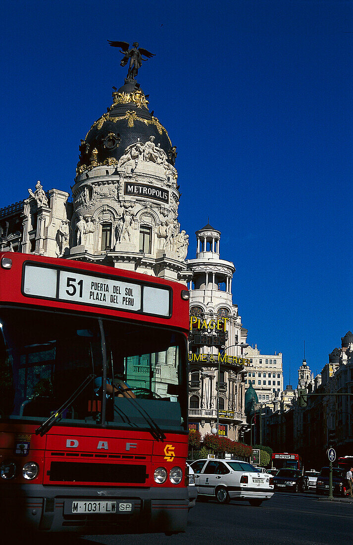 Bus on the street in front of the Metropolis Building, Gran Via, Madrid, Spain, Europe