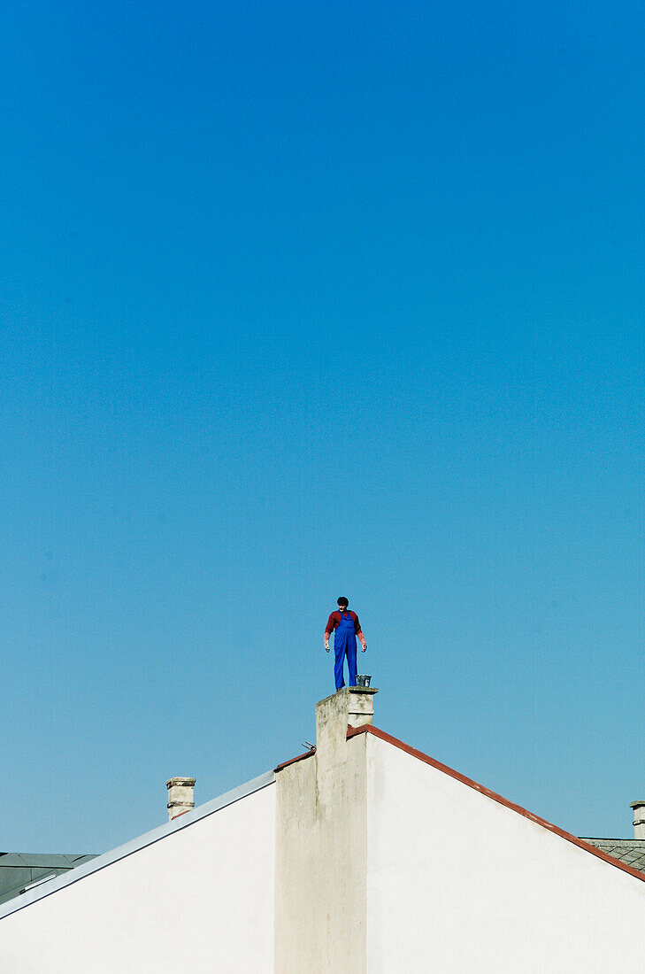 Man on roof, people on roof