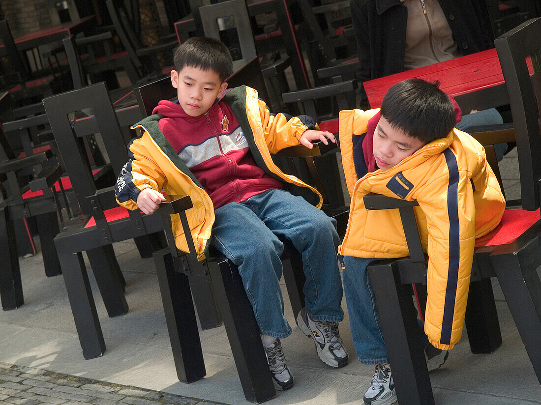Sitting boys, tired children, Shanghai, China