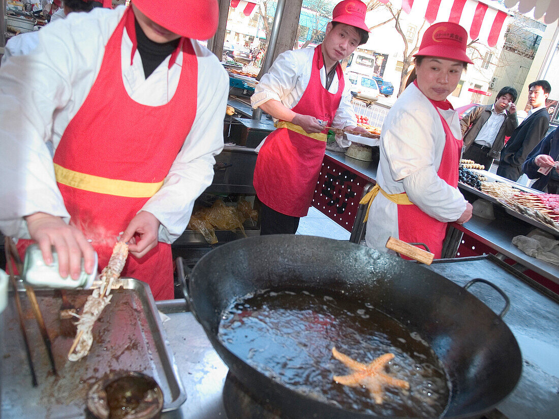 People cooking, travel chinese food stand, Shanghai, China, Asia