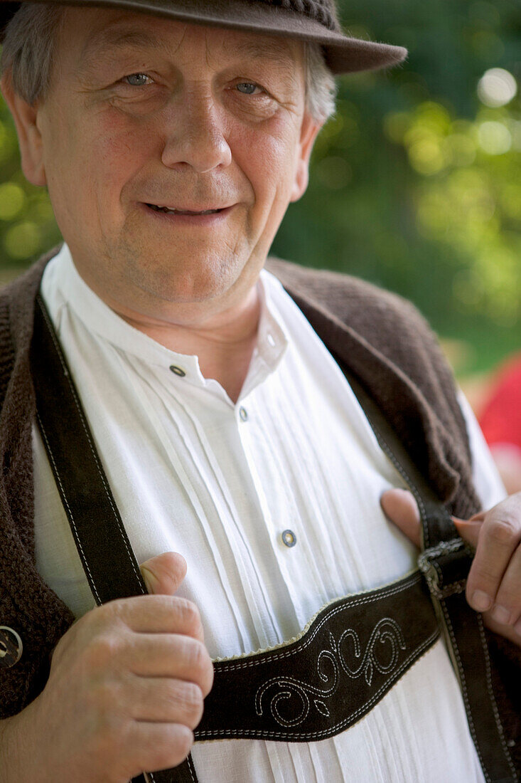 Older Bavarian man wearing traditional clothes, Munich, Bavaria