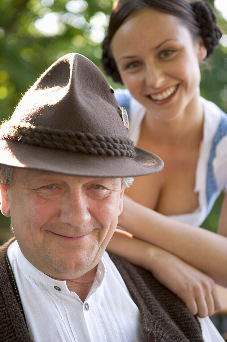 Older Bavarian man and young woman , Munich, Bavaria