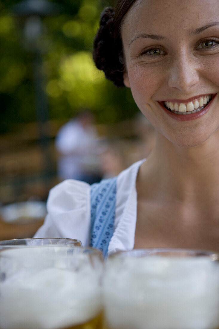 Waitress with beer glasses, Starnberger See Bavaria, Germany