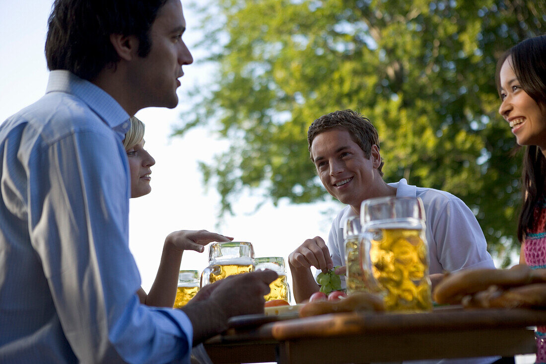 Group of young people in beer garden, Munich, Bavaria