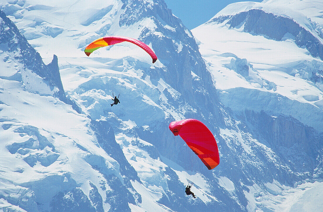 Two people paragliding at the mount Montblanc, Chamonix, France, Europe