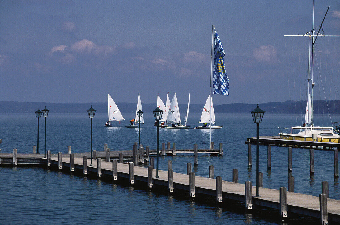 Sailing boats near a wooden jetty, Seeshaupt, Upper Bavaria, Bavaria, germany