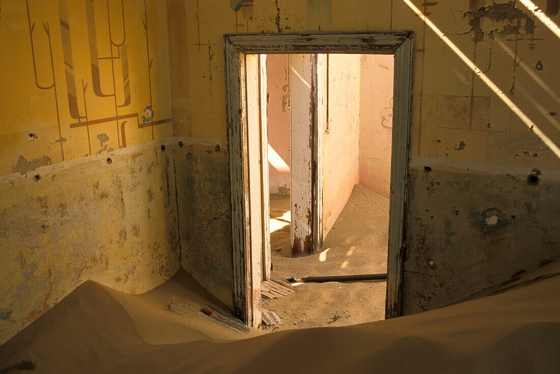 Abandoned house full of sand, Former mining village, now a ghost town, Kolmanskop, Namibia, Africa